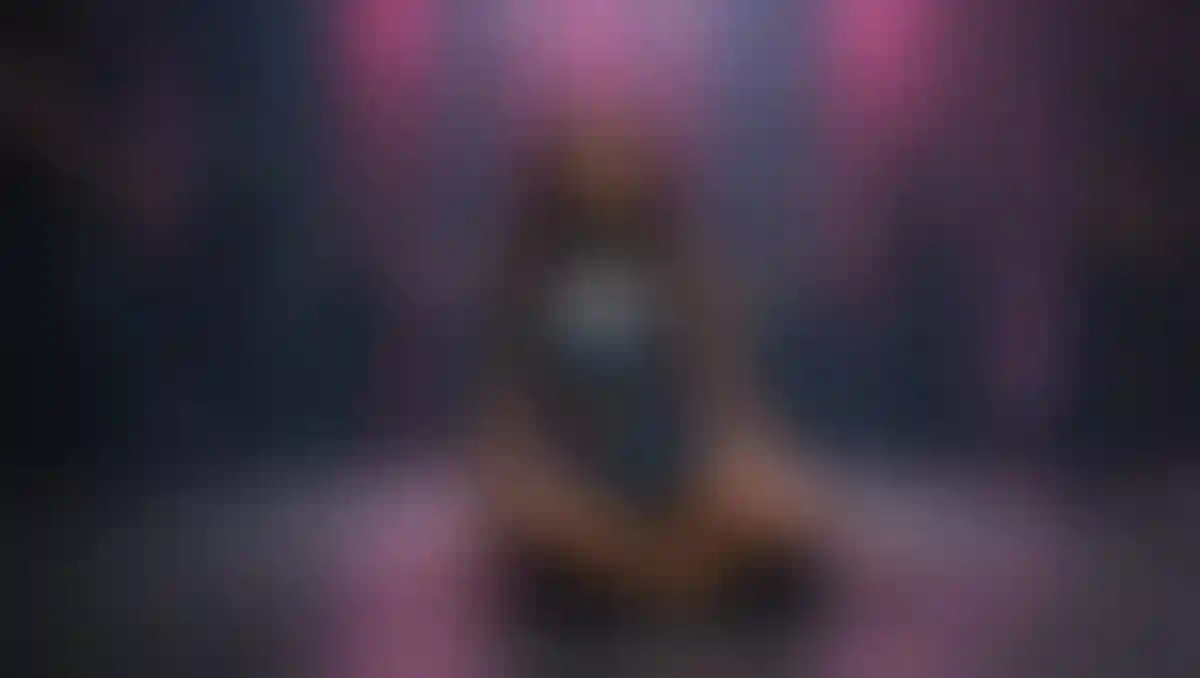 Who is the woman appearing in the music video for 'Versace on the Floor'?
